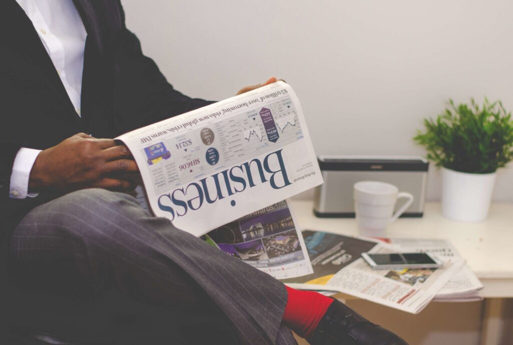 A Man reads a newspaper